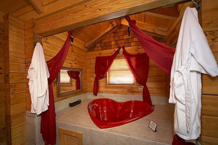 heart shaped bathtub inside a cabin in Pigeon Forge